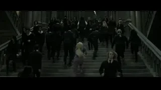 People in formal attire walking up stone stairs — Harry Potter and the Deathly Hallows 2