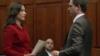 woman in red blazer speaking to man — Suits