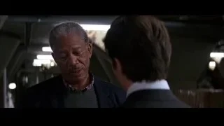 two men conversing in dim room — Batman
