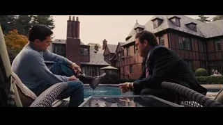 two men by pool on patio — The Wolf Of Wall Street