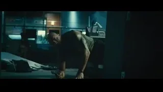 man holding gun in dark room — Furious Seven