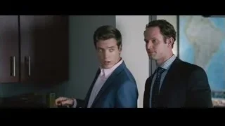 two men conversing in office with coffee — The Big Short