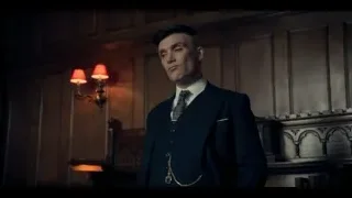 Man standing in dimly lit room with fireplace — Peaky Blinders