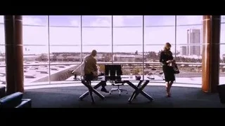 Man and woman in office with city view — Iron Man