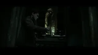 Young man in dark room with window — Harry Potter and the Deathly Hallows 2