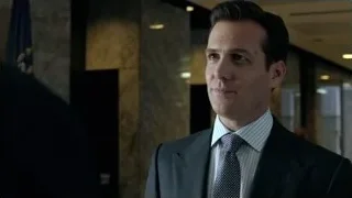 man in suit standing in hallway with flag — Suits
