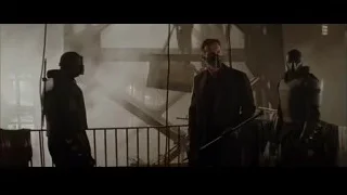 man in mask with sword on balcony — Batman