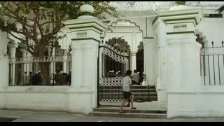 Ornate white building with green dome — Life of Pi