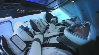 two astronauts in space shuttle cockpit — Elon Musk: Return to Space