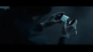 man's face on phone screen — John Wick