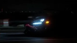 red sports car driving on highway at night — Sports Cars