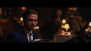 young man in restaurant with piano — La La Land