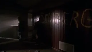 man in suit with gun in graffiti room — Breaking Bad