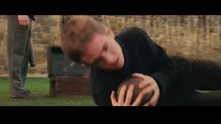 man lying on grass near stone wall and chest — Harry Potter and the Philosophers Stone