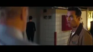 two men in close-up conversation — Interstellar