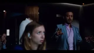 man and woman looking in dim room — Jurassic World