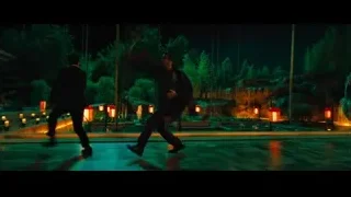 Two people performing martial arts in park at night — John Wick: Chapter 4