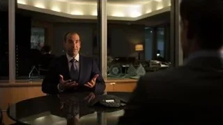 man in suit talking at office desk — Suits