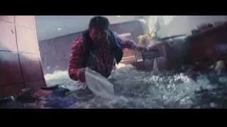 man in red jacket in flooded room — The Wolf Of Wall Street
