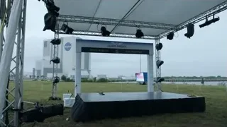 stage under tent with city skyline — Elon Musk: Return to Space