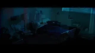 man and woman in room with green walls — La La Land