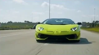 yellow Lamborghini Huracan driving on highway — Sports Cars