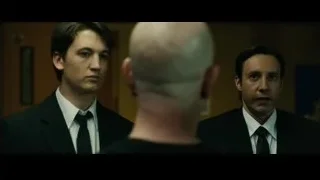 two men in suits conversing — Whiplash