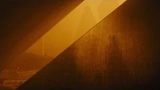 triangular building under hazy orange sky — Blade Runner 2049