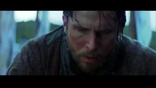 man with beard speaking in dim outdoor setting — Batman