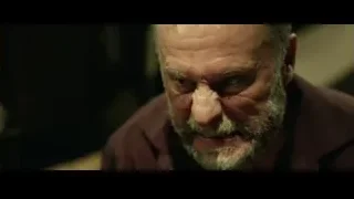 Elderly man with white beard serious expression — John Wick