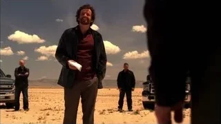 man standing with others in desert — Breaking Bad