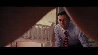 young man on subway looking at phone — The Wolf Of Wall Street