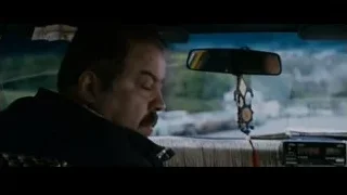 Man in black jacket looking out car window — The Persuit of Happyness
