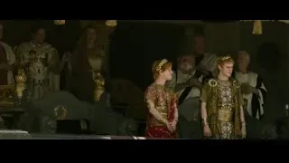 people in ancient costumes around large throne — Gladiator 2