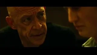 older man's serious face looking at camera — Whiplash