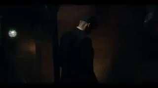 Man with lantern on balcony overlooking city — Peaky Blinders