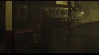 Person in long coat at train station — Peaky Blinders