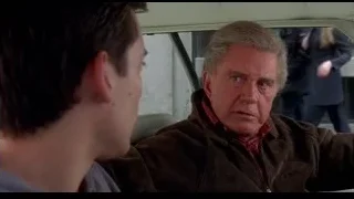 two men in back seat of car — Spider Man