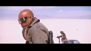 bald man with red paint in desert — Iron Man