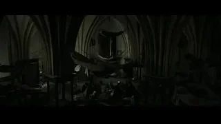 People gathered around hammock in dark church room — Harry Potter and the Deathly Hallows 2