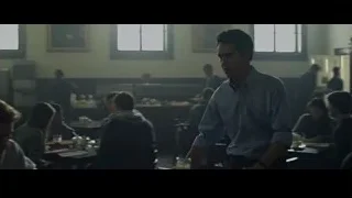 Men conversing and eating in restaurant — The Social Network