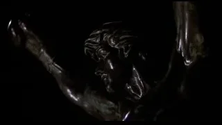 bronze statue of muscular man with spear — Rocky III