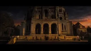 Ornate church with people on steps at sunset — John Wick: Chapter 4