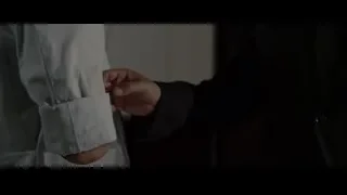 person's hand holding white shirt — The Amazing Spider Man