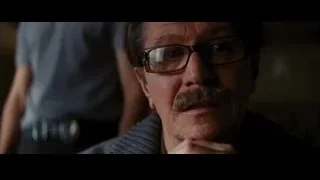 Man with mustache and glasses, hand on chin — Batman: The Dark Knight Rises