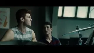 Two young men playing drums in dimly lit room — Whiplash