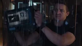 man holding tablet in dark prison cell — The Avengers