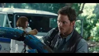 man with gun near car in forest — Jurassic World