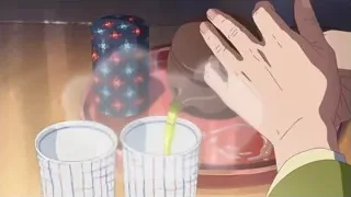 person pouring green liquid into cup — Your Name