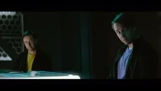 two men looking at computer screen — The Social Dilemma